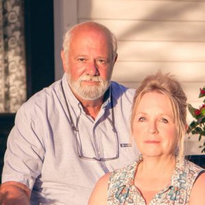 Man and Women on front porch at Jacksonville Wedding Venue