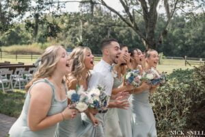 Wedding party gets the first look of the bride at All4One Farms wedding venue.