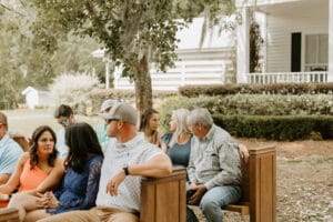 Wedding guest seated in pews at All4One Farms waiting for the ceremony to start.