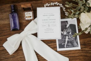 Wedding invitation with old photography and wedding bands