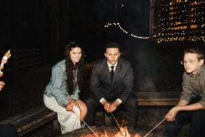Bride and Groom around the fire pit at All4One Farms wedding venue.