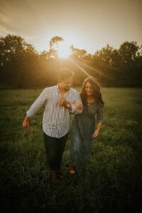 Newly engaged couple in the glow of a beautiful sunset at All4One Farms