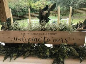 Sweetheart table decorated with candles and greenery at All4One Farms.