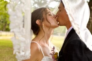 Bride and groom kissing at Jacksonville wedding venue.