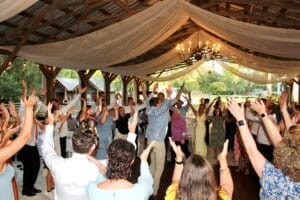 Crowd dancing at wedding reception at Jax wedding venue