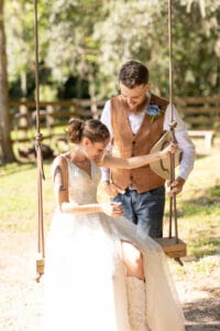 Bride and groom on a swing at Jax wedding venue.