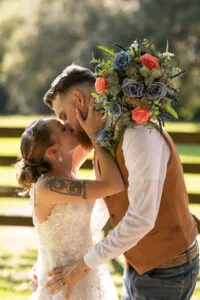 Bride and Groom kiss at Jax wedding venue.