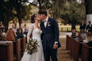 Bride and groom kissing at Jax wedding venue.