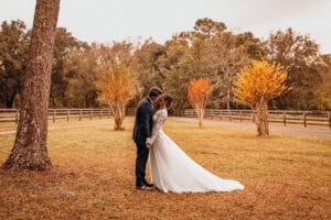 Jax wedding venue-bride and groom with fall background