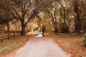 Jacksonville Wedding Venue, Bride and groom in the treelined drive.